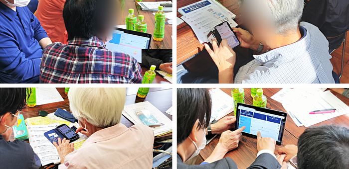 スマホやタブレットで入力を行う市民の方々